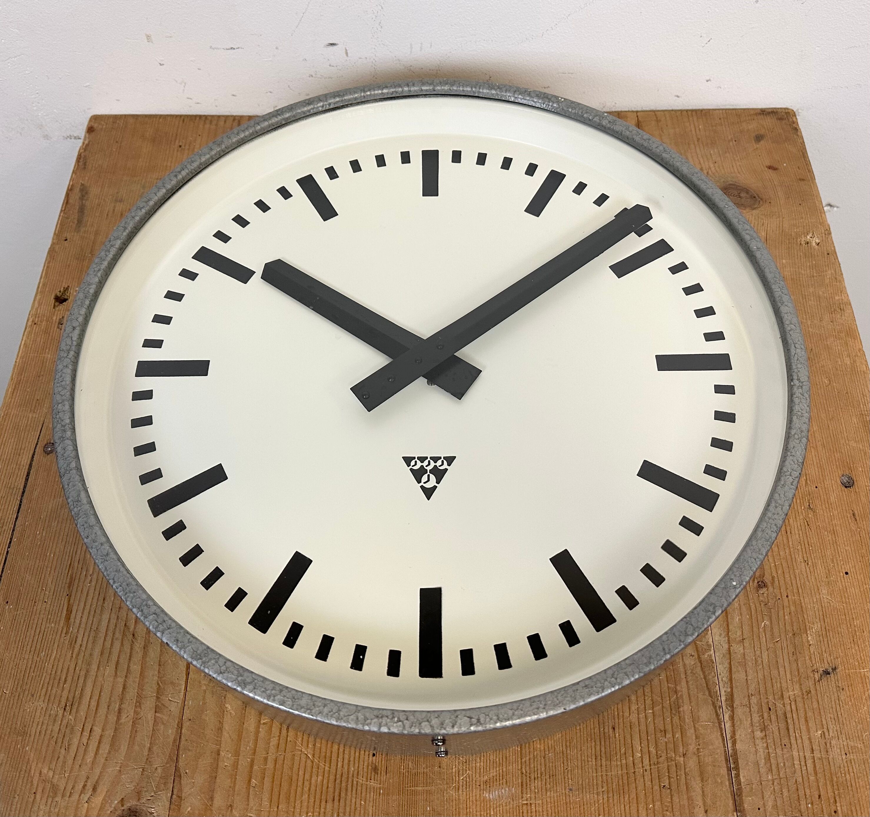 Grey industrial factory wall clock from pragotron, 1960s