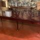 Directoire period extendable dining table in mahogany with a band.