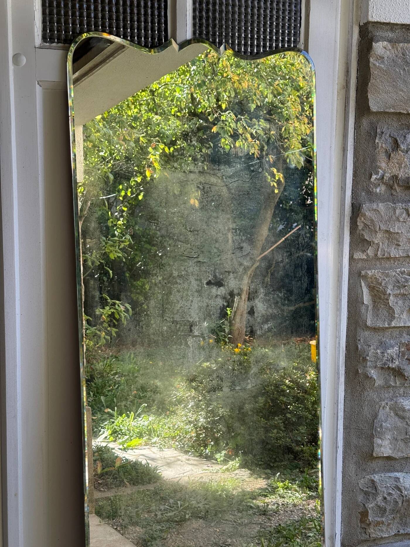 Large vintage mirror with bevelled glass.
