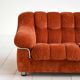 Vintage rust velvet sofa from the 1970s with metal details.