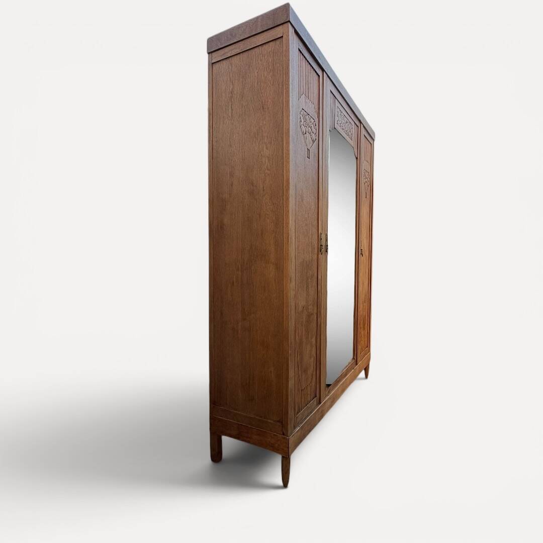 Art deco wardrobe in raw oak with bevelled mirror.