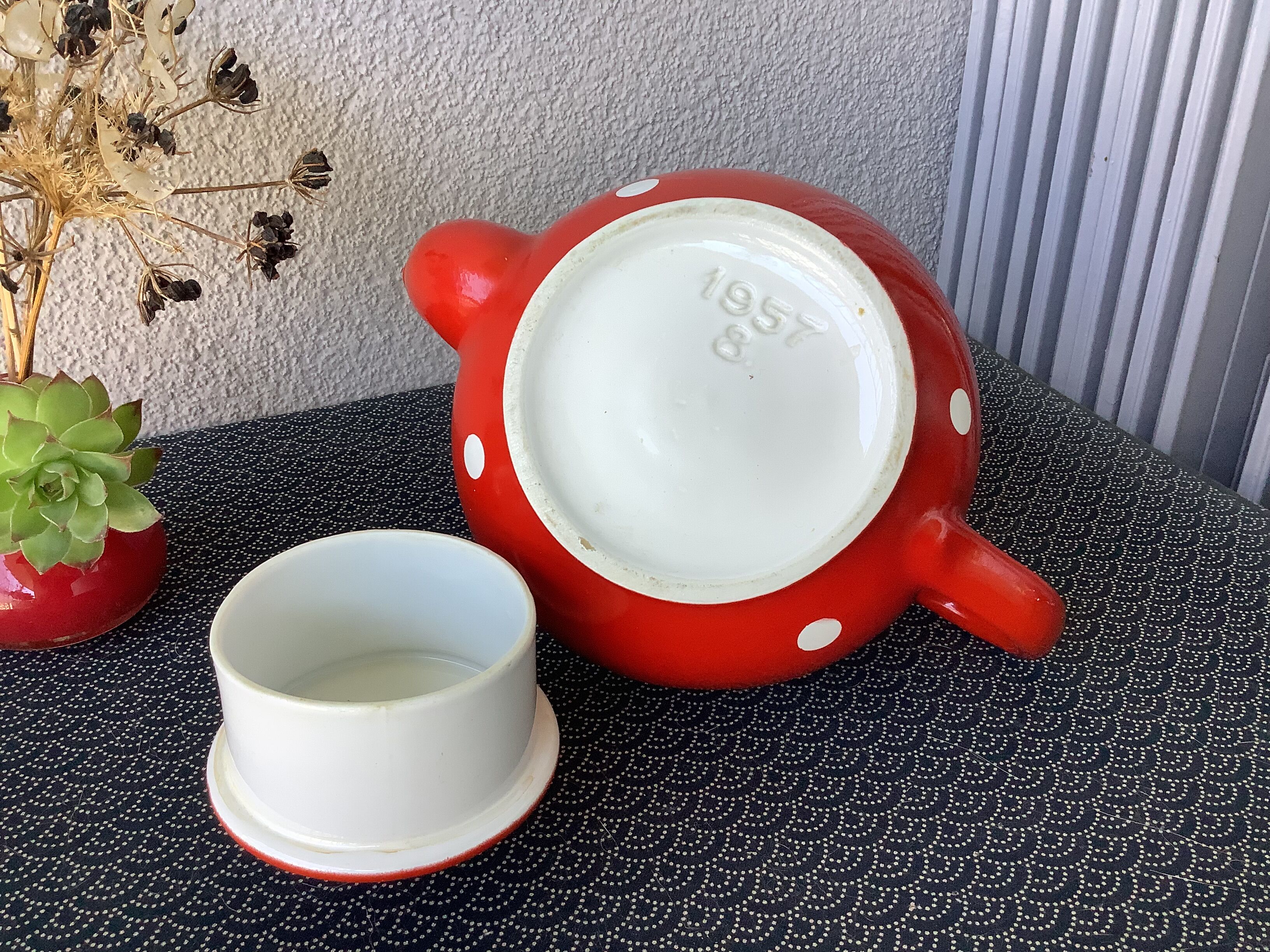 Vintage red teapot with white polka dots