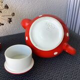Vintage red teapot with white polka dots