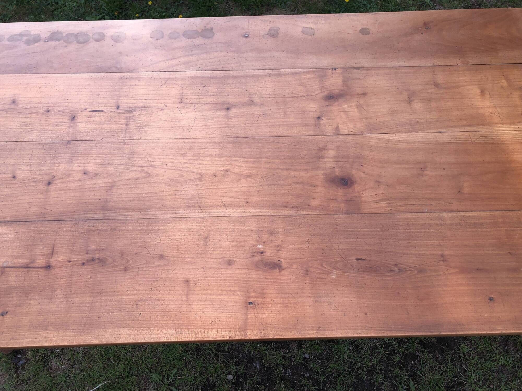 Antique farmhouse table in solid cherry wood with 2 drawers and 1 pull-out at the end with turned legs.