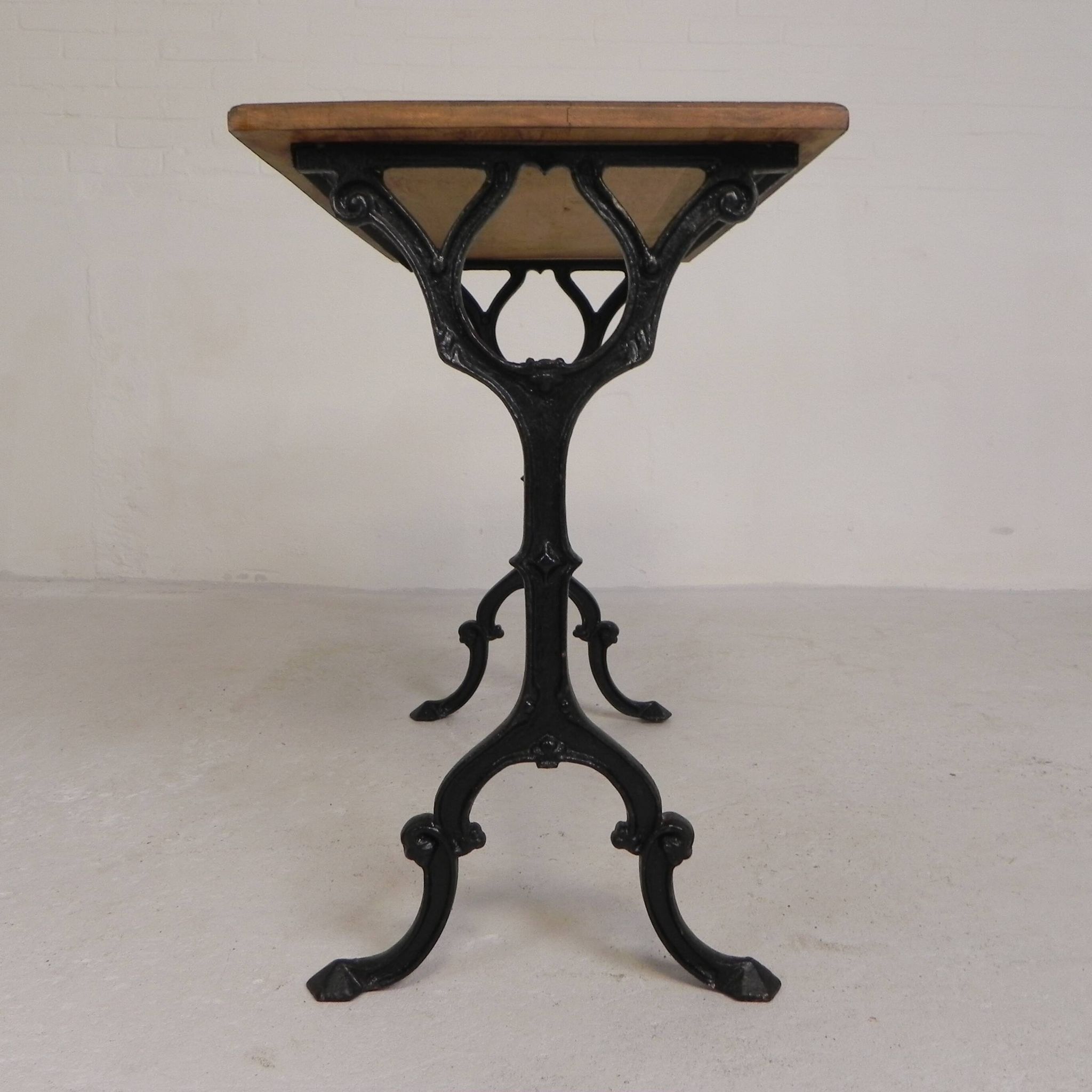 Bistro table with an oak top on a cast iron base, 1930s.