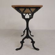 Bistro table with an oak top on a cast iron base, 1930s.