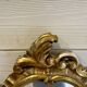 Vintage wall mirror in Louis XV / Baroque style – Carved wooden frame in gold.