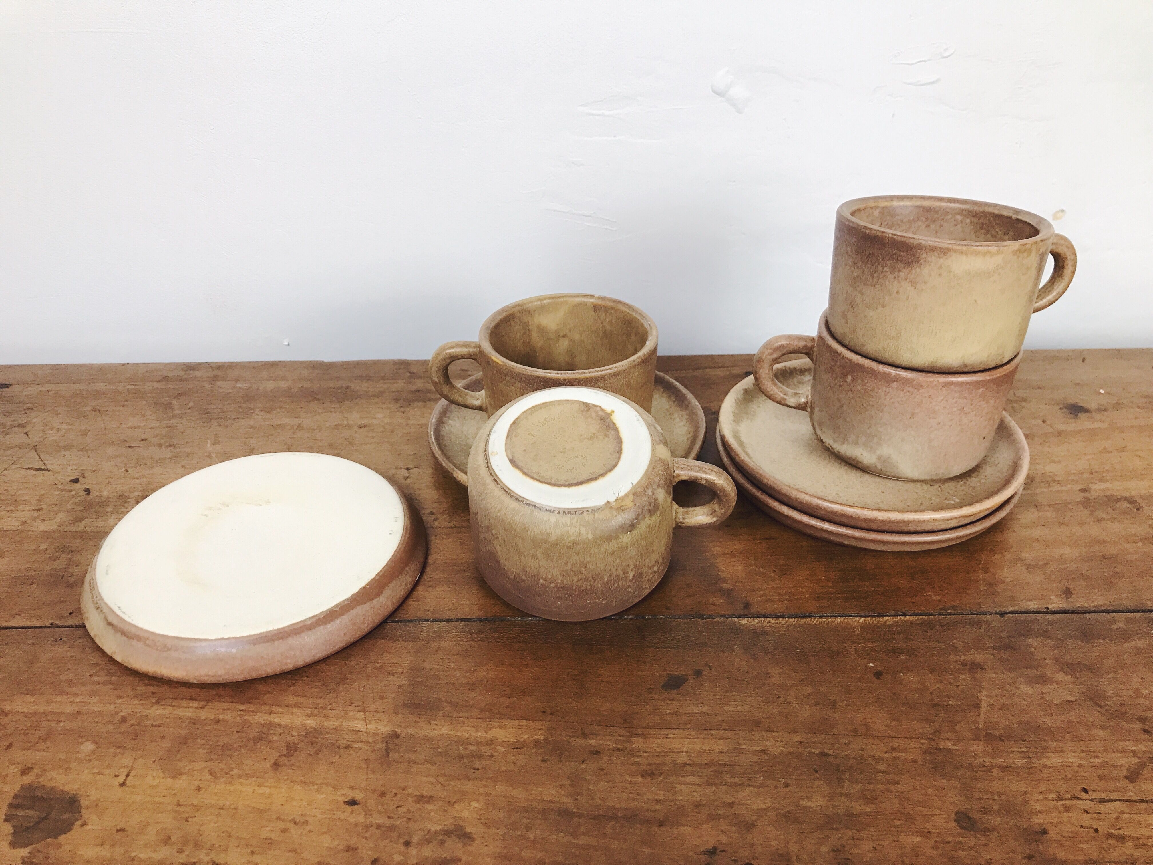 4 sandstone cups with under cups