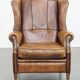 Sheep leather wingback chair finished with black piping