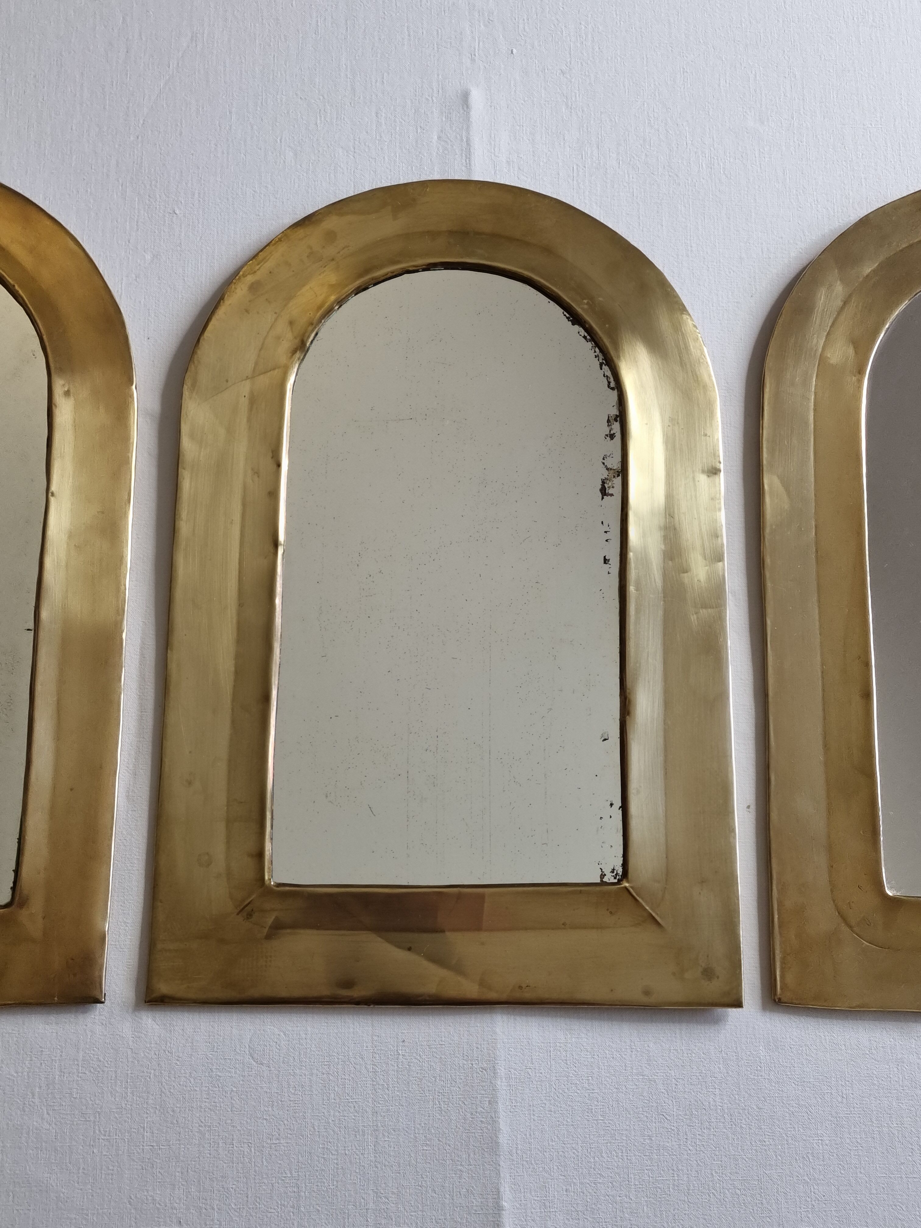 Set of three Moroccan brass mirrors in the form of arches, 43 cm