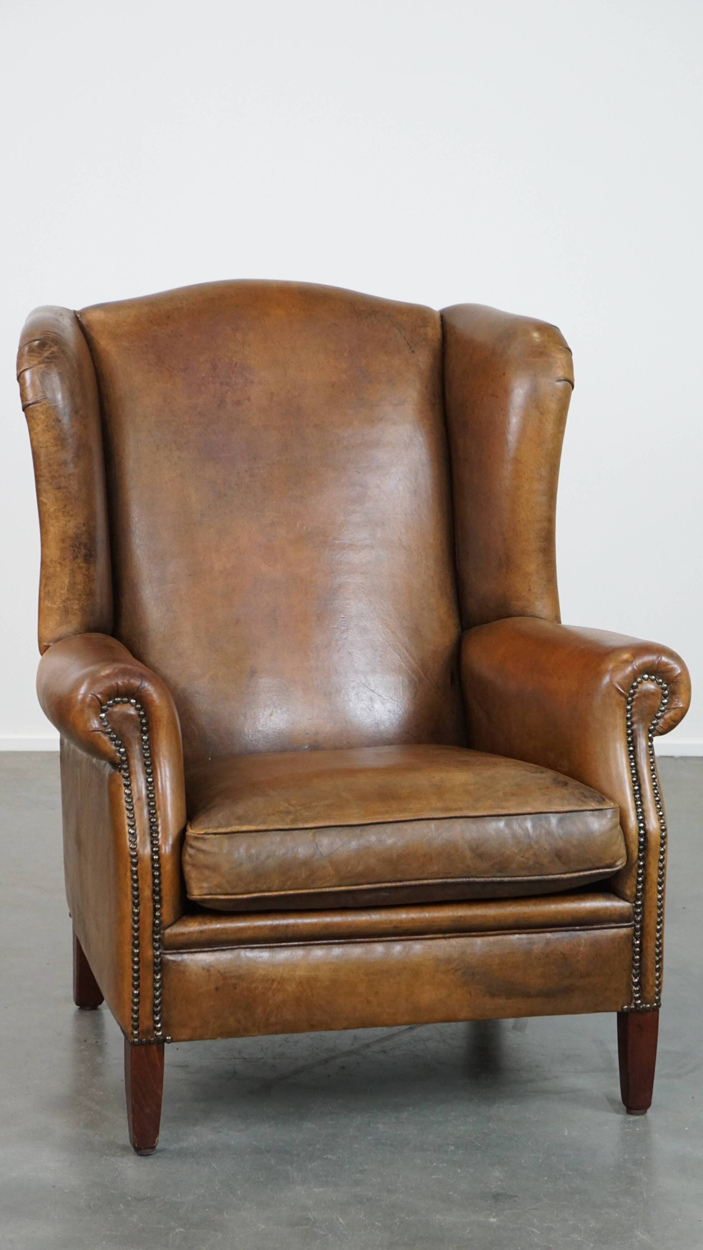 Sheep leather wingback chair with patina