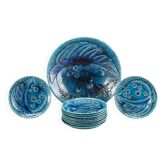 A stoneware bowl and 11 plates by Charlotte Hamilton, Sweden, 1970, Signed
