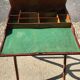 Bracelet holder and antique brown and green fabric watch, vintage 1920s furniture.
