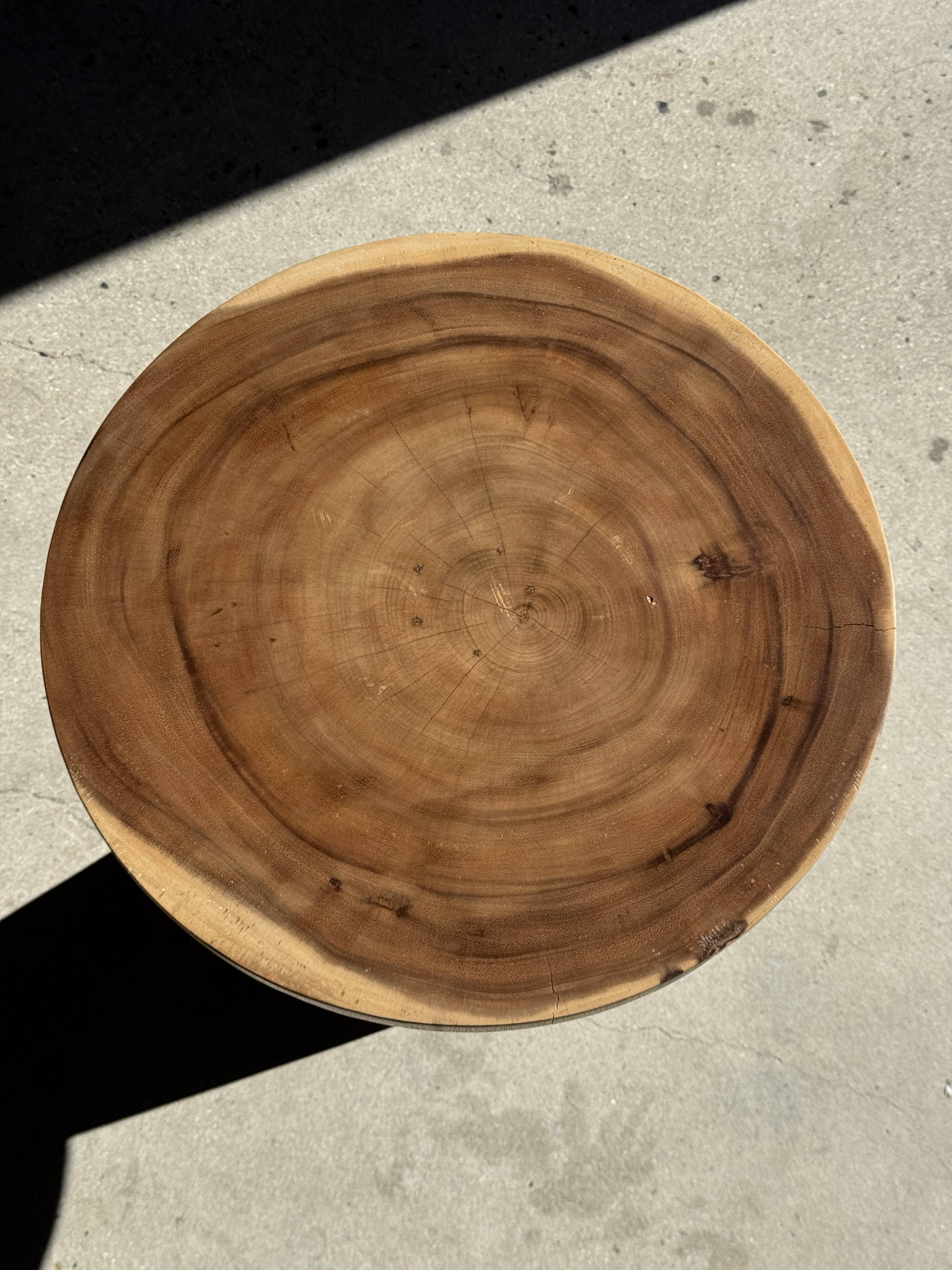 Natural solid suar side table (monoxyle) with a minimal conical base.