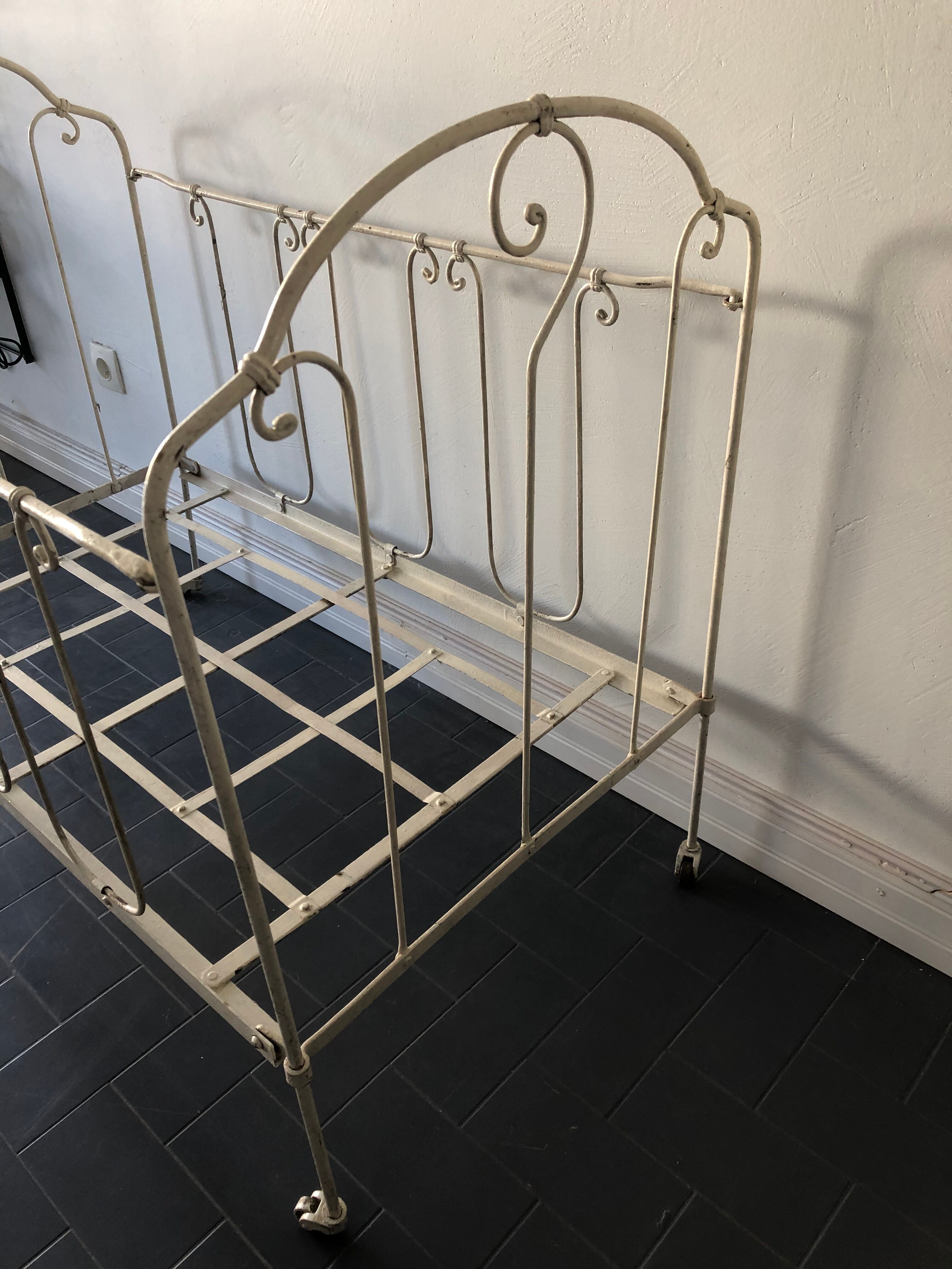 Old white wrought iron folding bed / seat