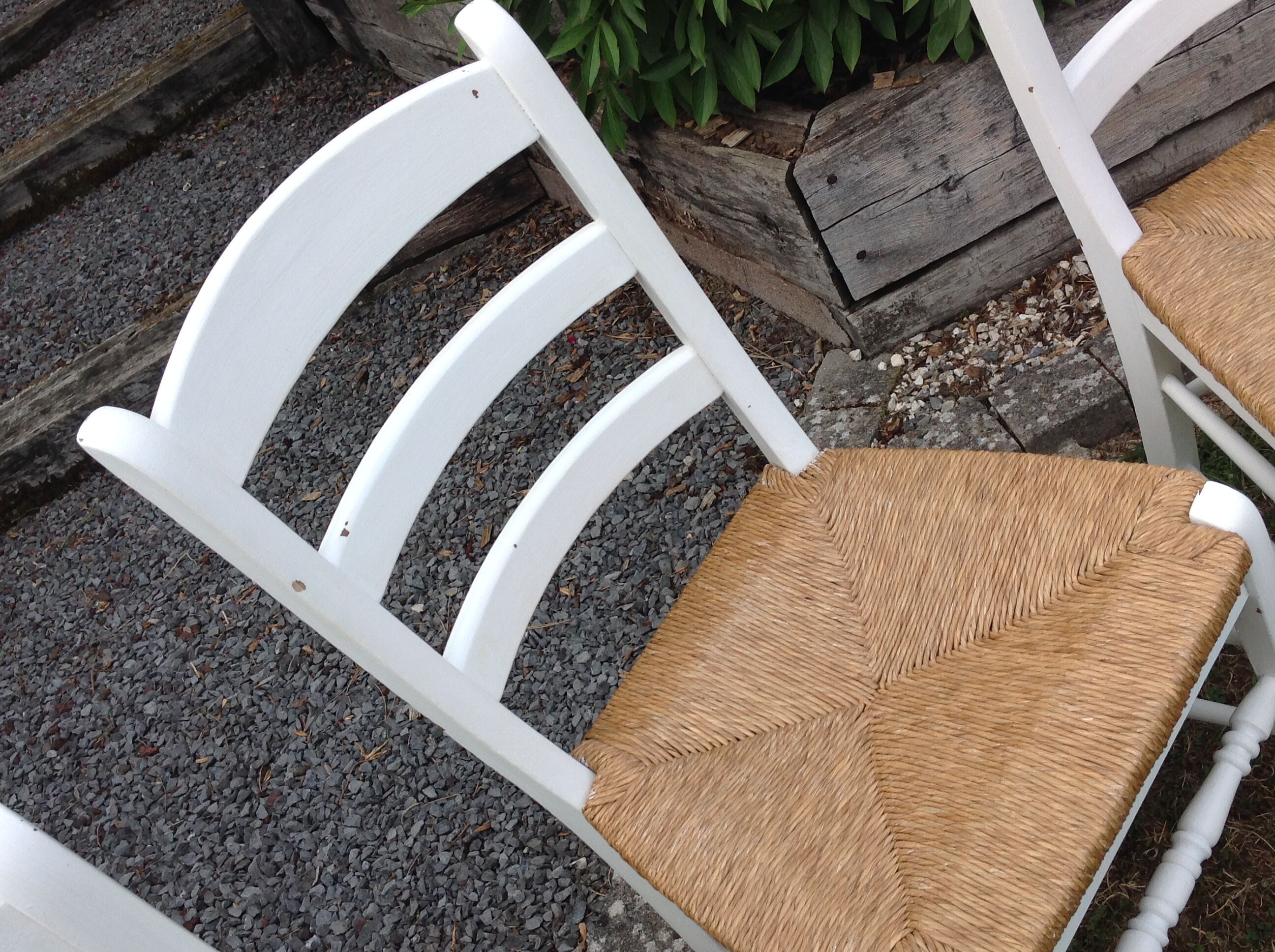 White farmhouse table set and four chairs