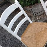 White farmhouse table set and four chairs