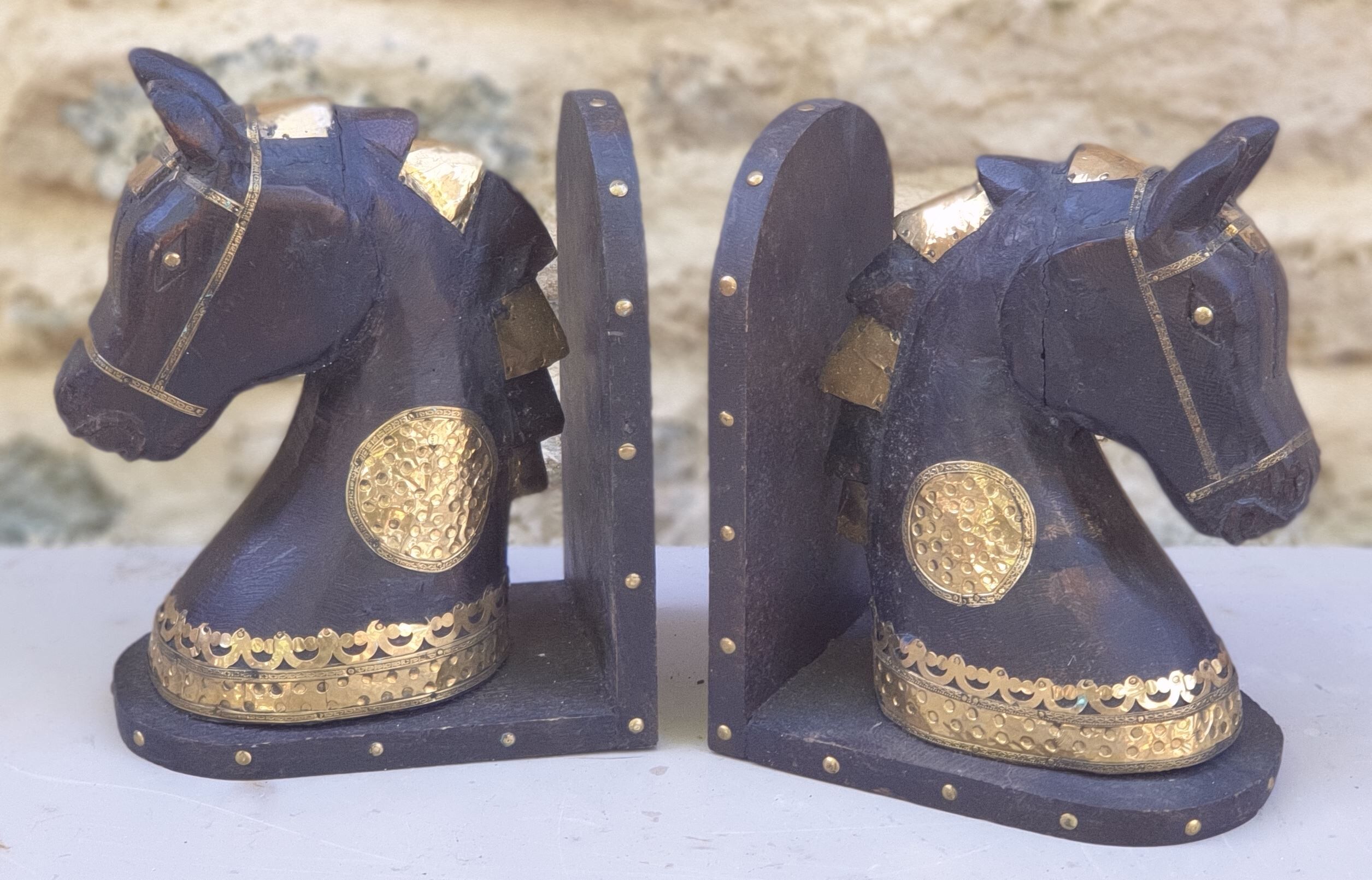 Horse bookbands in carved wood and brass