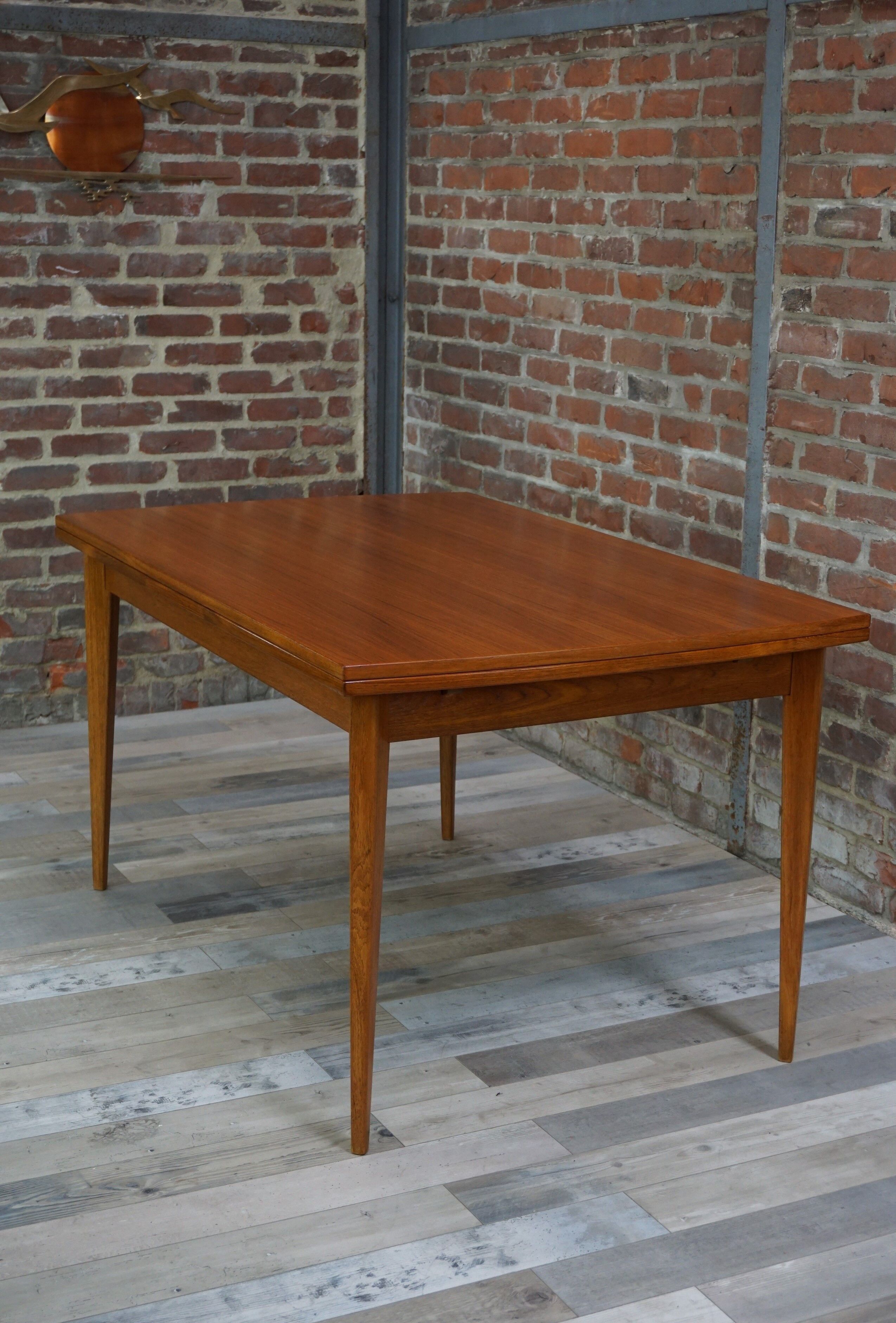 Teak dining table design by Johannes Andersen for Samcom 60s