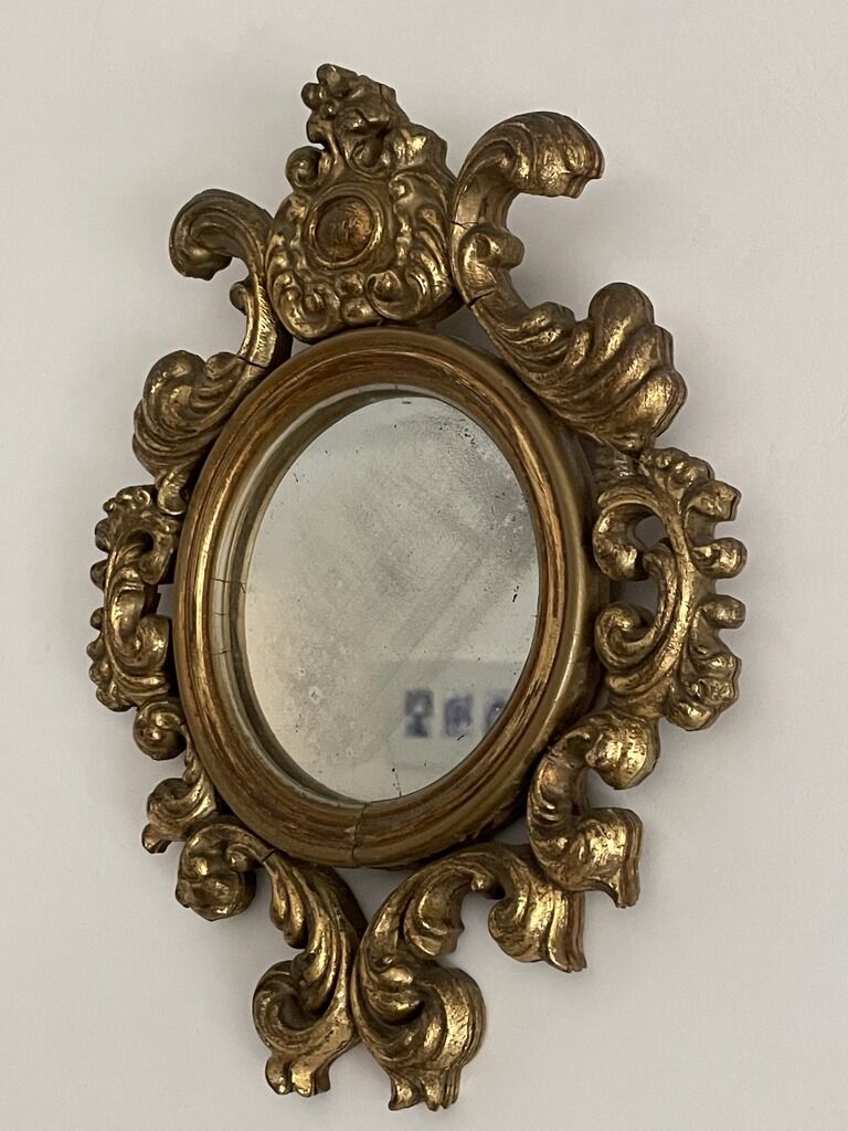 Old mirror in gilded wood