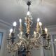 Lustre à bougies en fer forgé avec fleurs