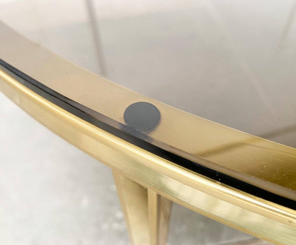 Mid-century Hollywood Regency style coffee table in brass and glass, made in Germany by Vereinigte Werkstätten, 1960s.