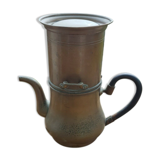 Copper coffee maker and blackened wooden handle