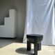 Black mango wood tripod side table with a semi-spherical top, height: 45 cm, diameter: 44 cm.