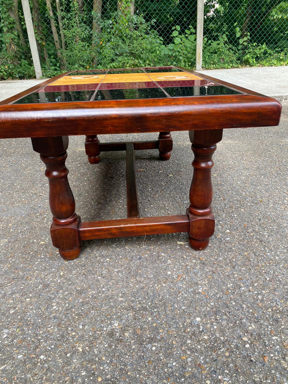 Solid wood and multicoloured ceramic coffee table from the 1970s.