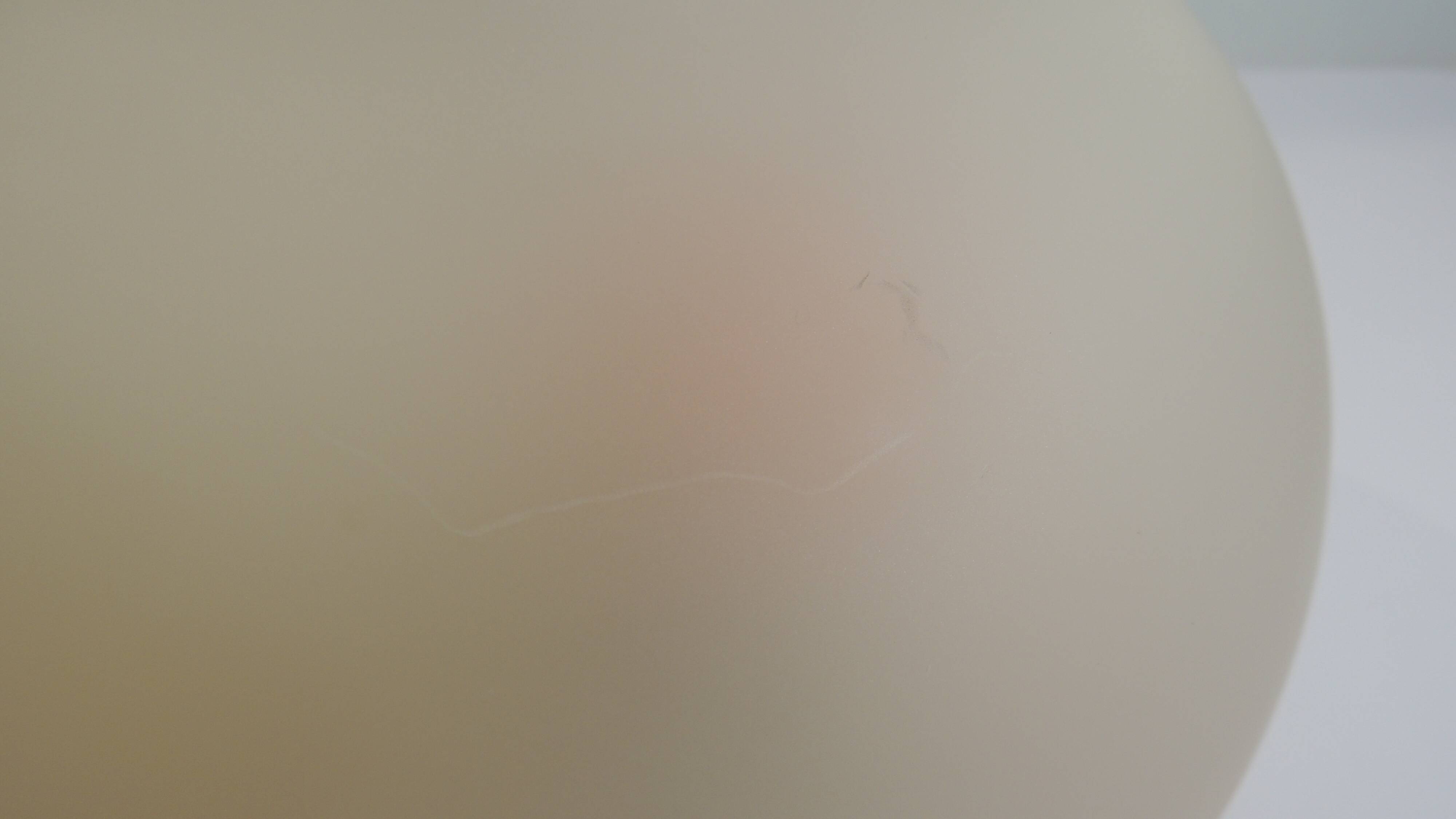 Vintage frosted glass lamp, round globe, elegant design, soft light.