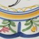 Large hand-painted French faience plate with floral decoration in folk art style.
