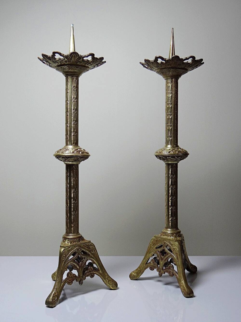Large pair of antique gilded bronze candlesticks, Gothic style from the 19th century.