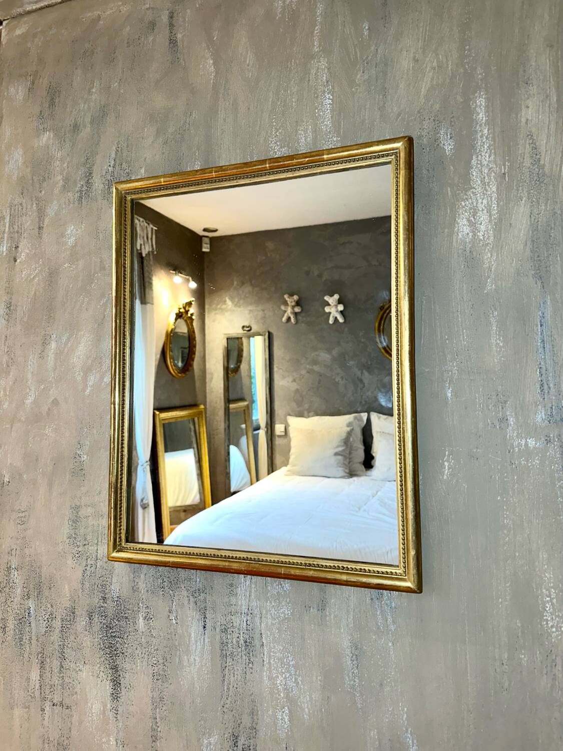 Antique beaded mirror with gold leaf