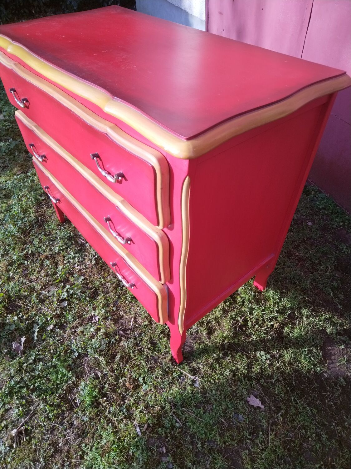 Matte gold and red patinated chest of drawers