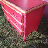 Matte gold and red patinated chest of drawers