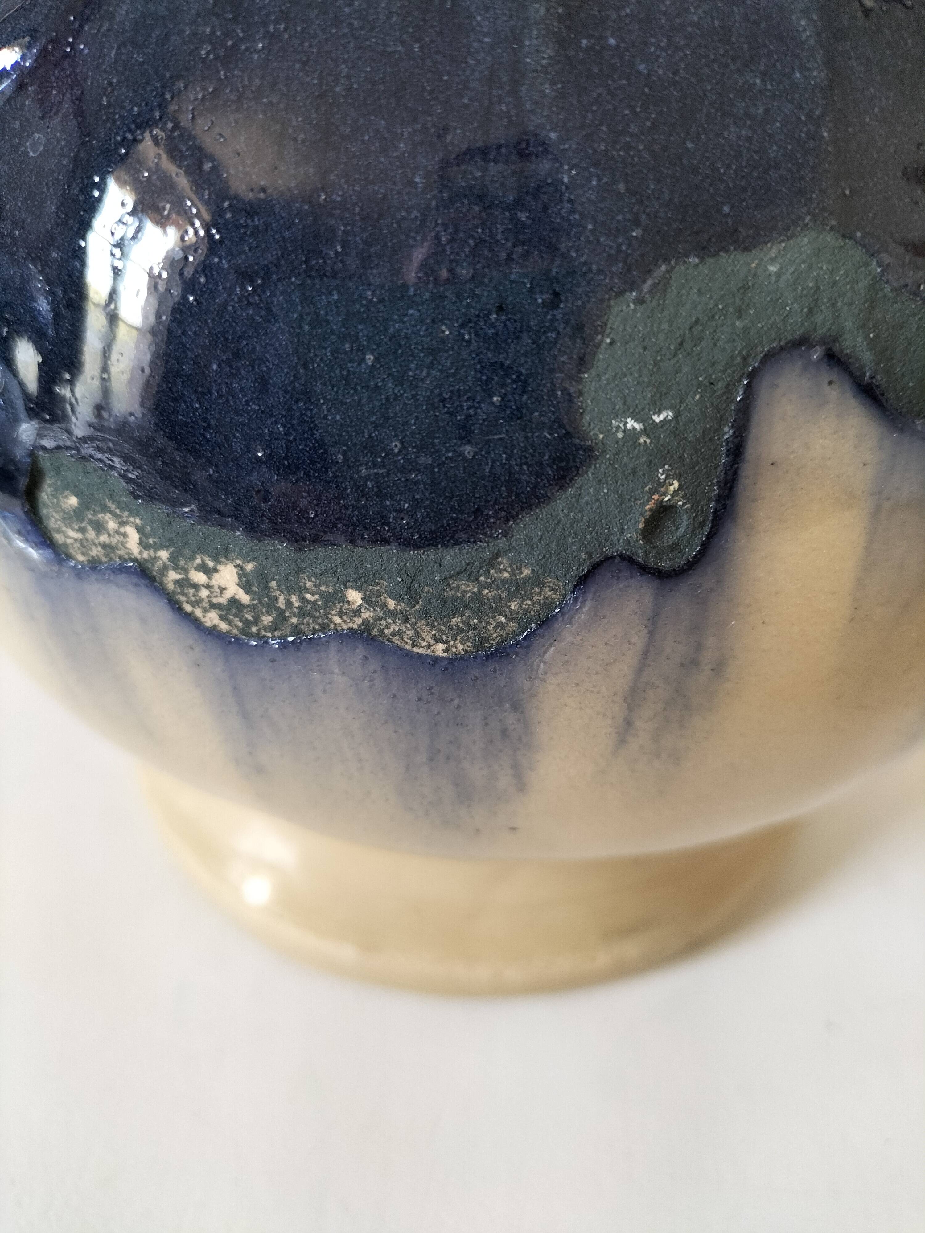 handcrafted ceramic jug with navy blue drip glaze.