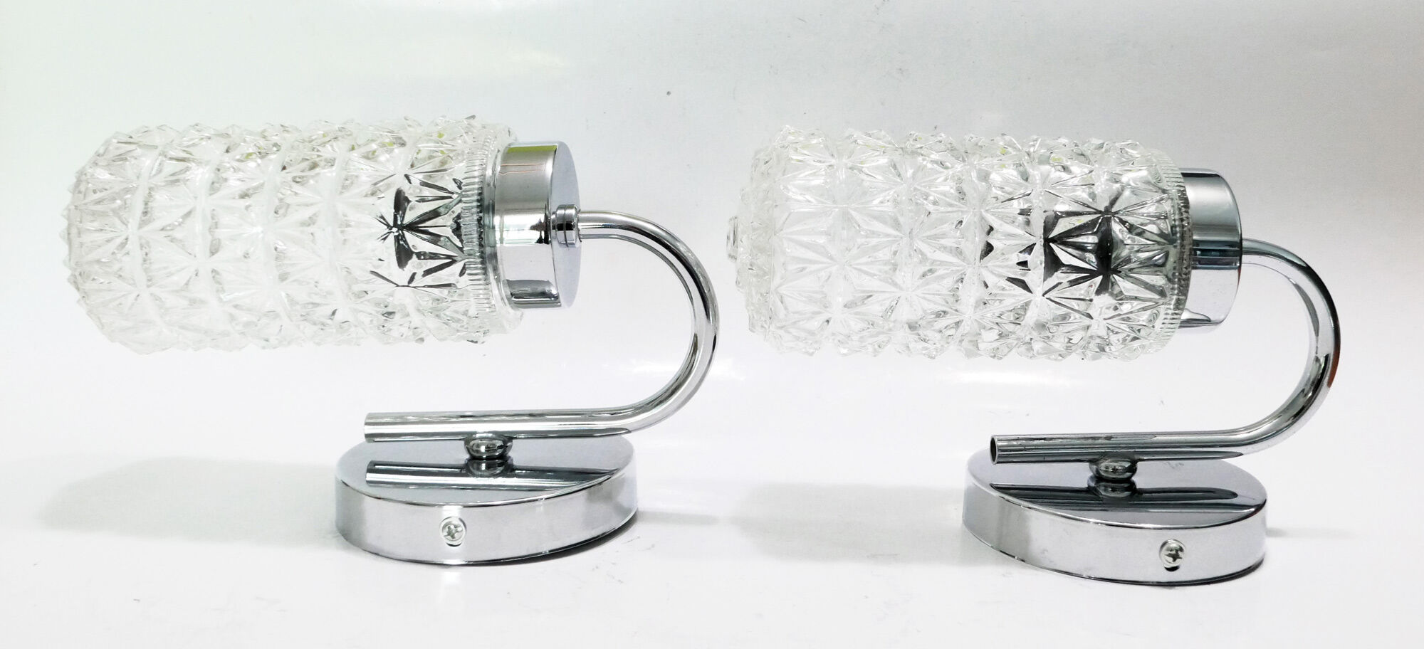 Pair of 1970 chrome metal wall light and molded glass globes.