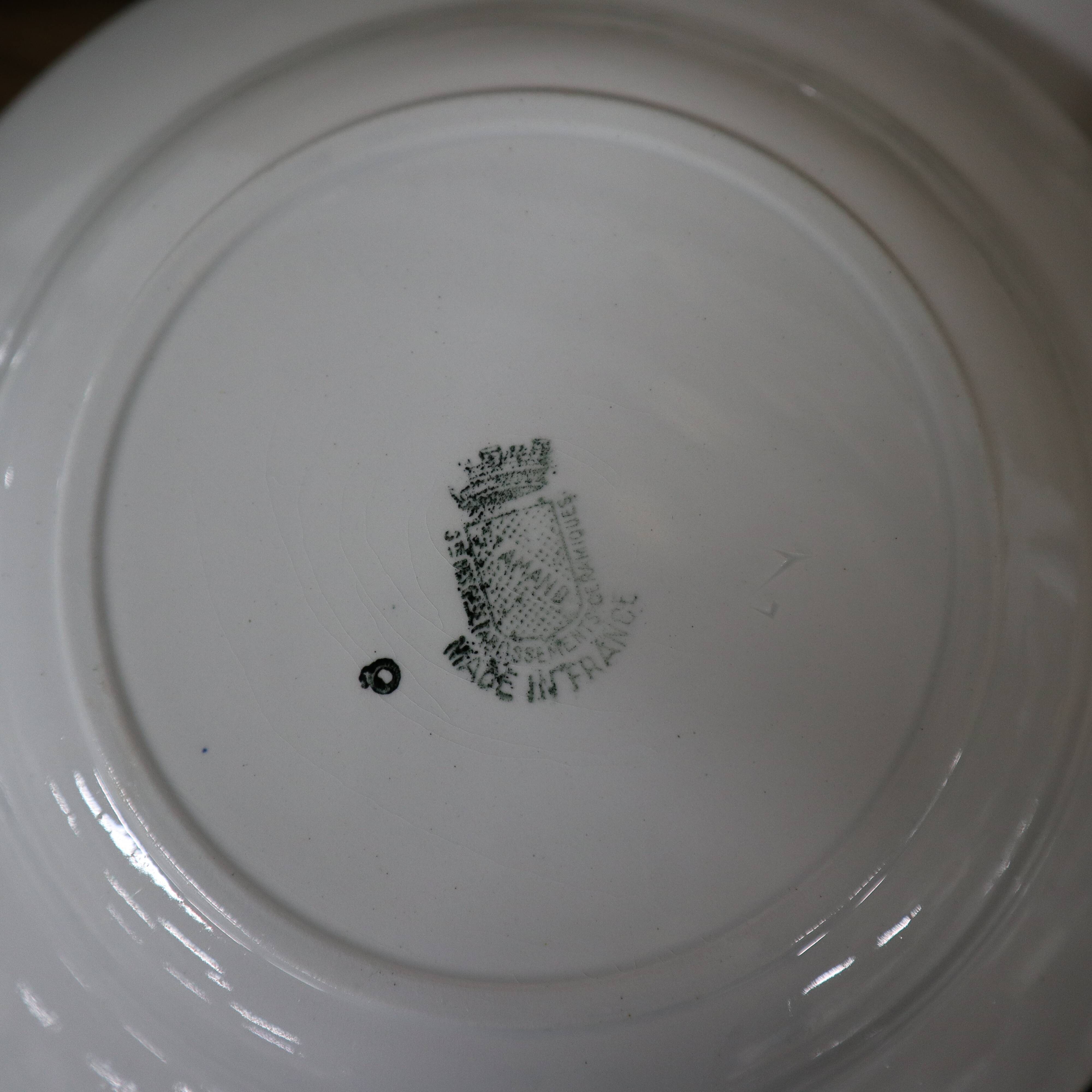 11 white and green earthenware soup plates from Saint Amand Terre de Fer