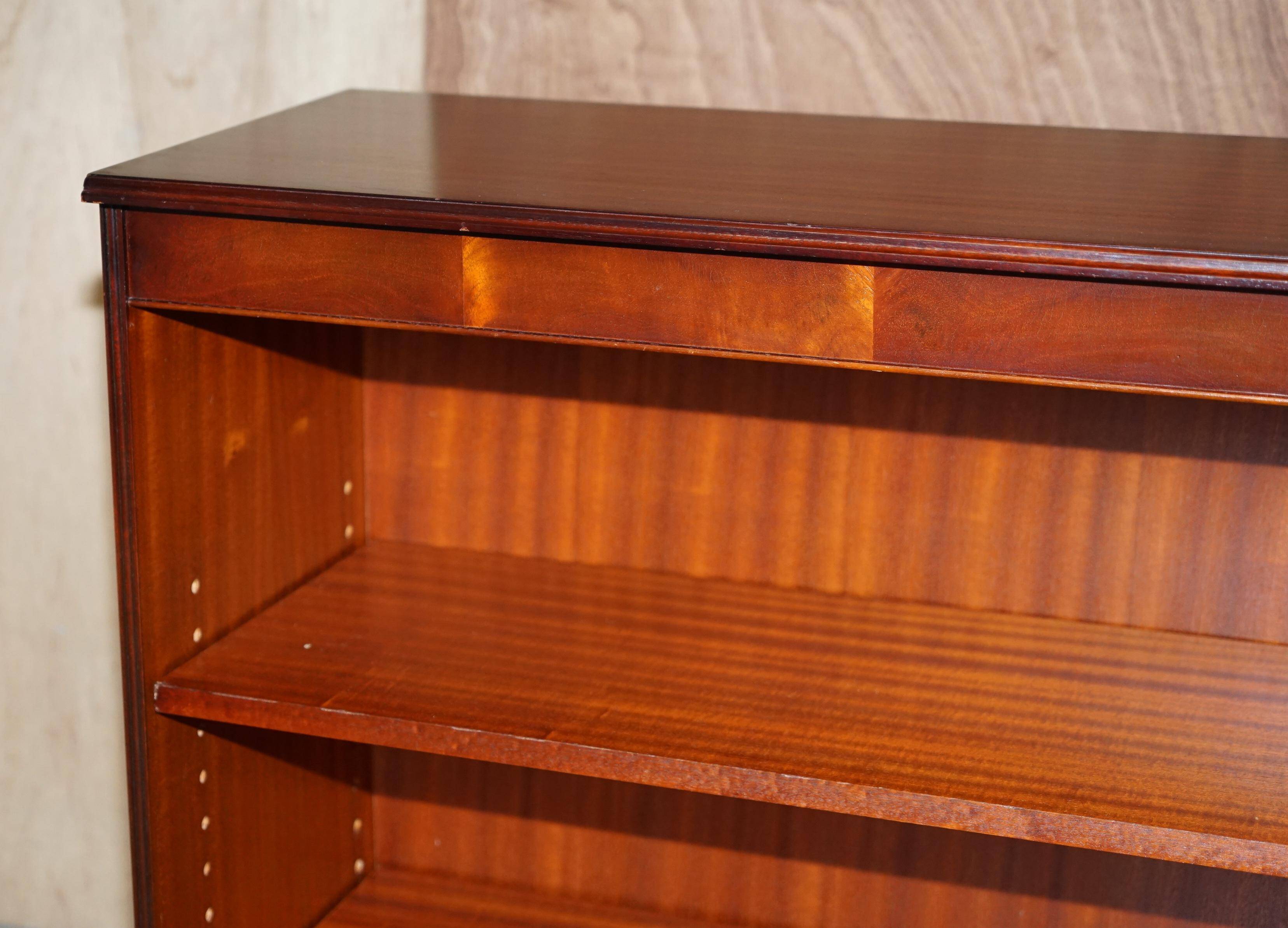 Pair of open low bookshelves Shaws of London in hardwood.