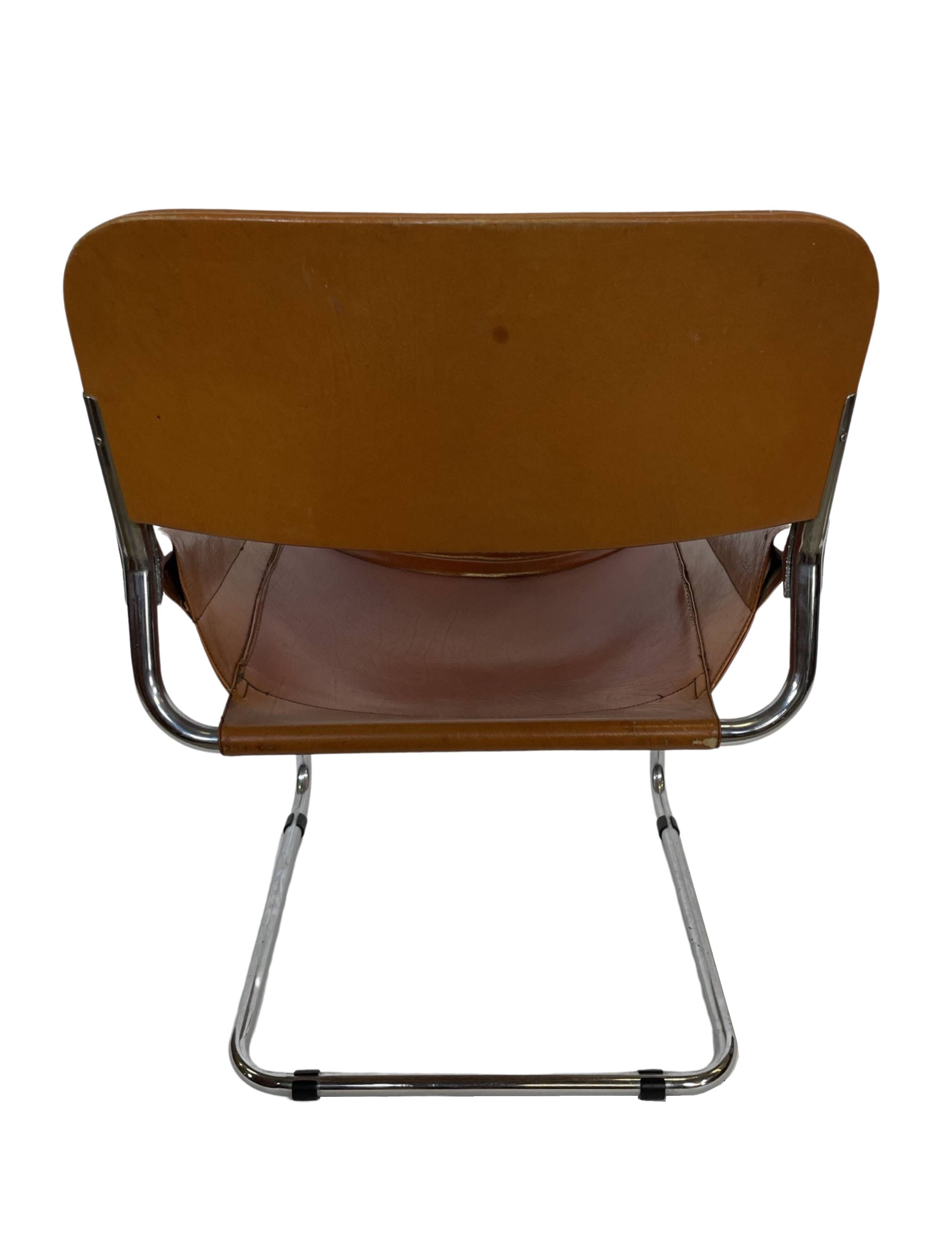 vintage dining room chair in cognac leather and chrome 1970s Italy