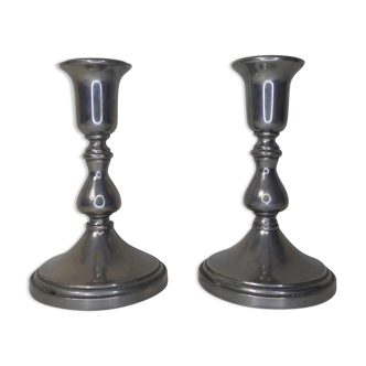 pair of silver metal candle holders