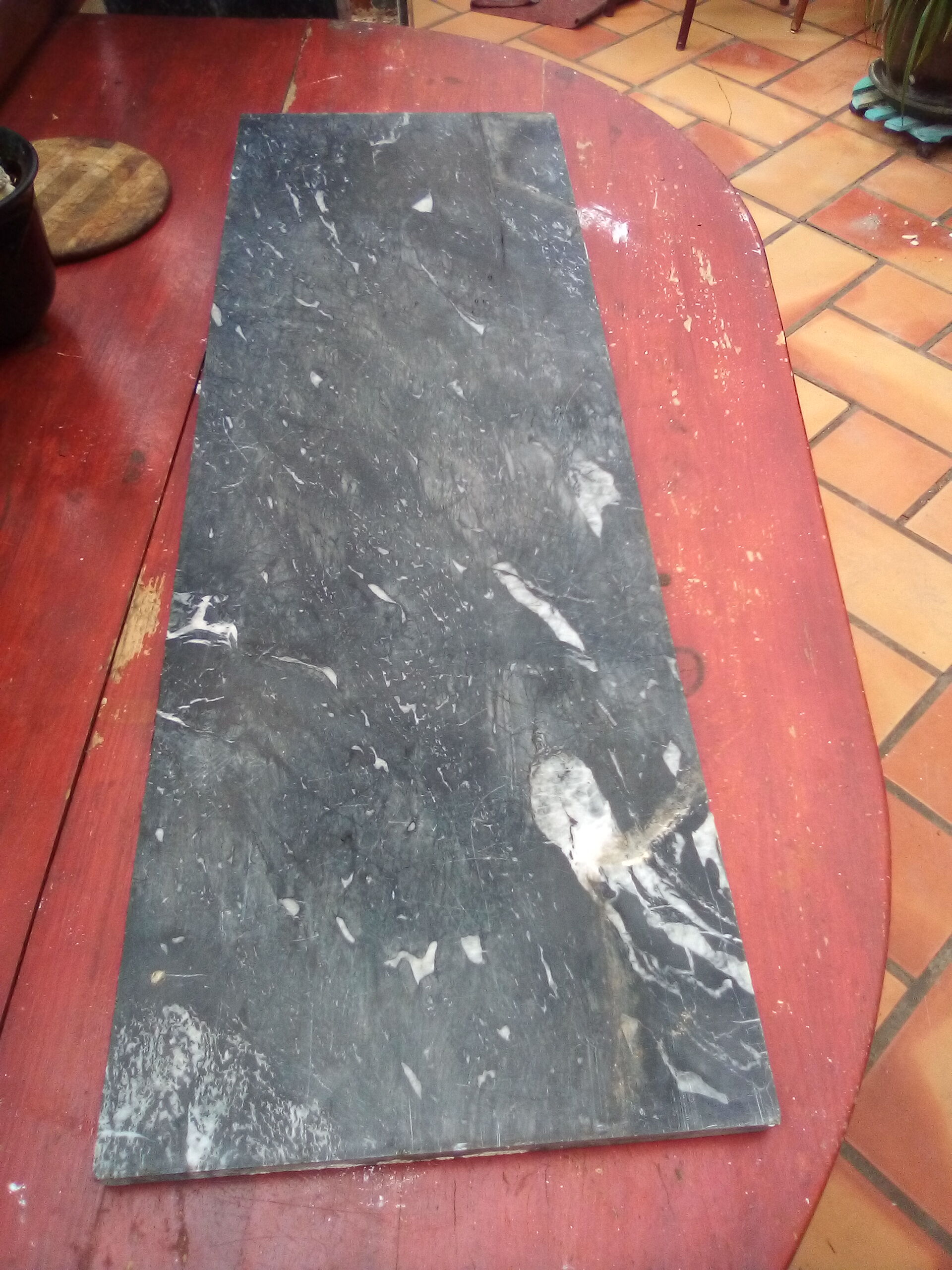 White veined black marble fireplace