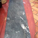 White veined black marble fireplace