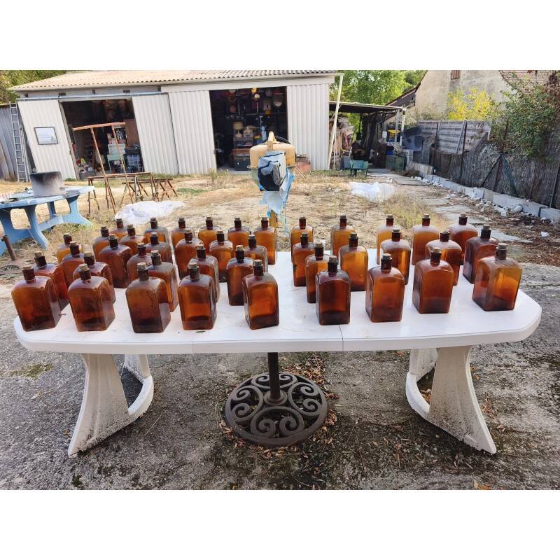 Set of 41 brown glass pharmacy bottles.