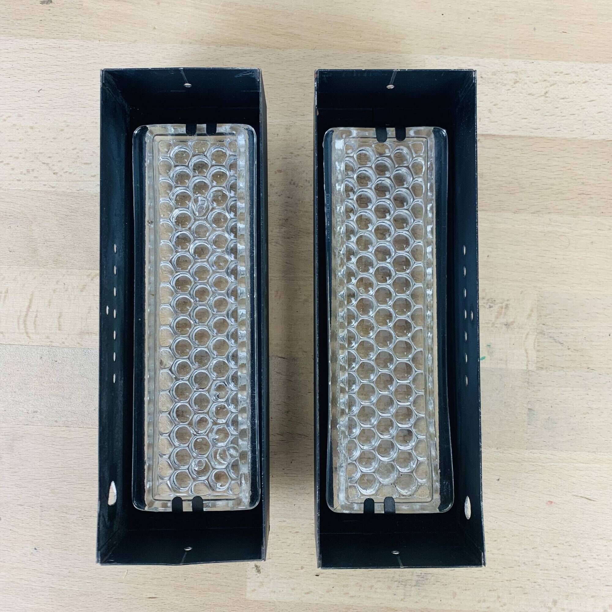 Pair of molded glass and metal wall lights from the 1950s