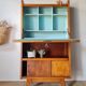 Vintage 1950s wooden secretary with tapered legs and mint interior.