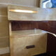 Bed with integrated bedside in rosewood and parchment, art deco period, twentieth century