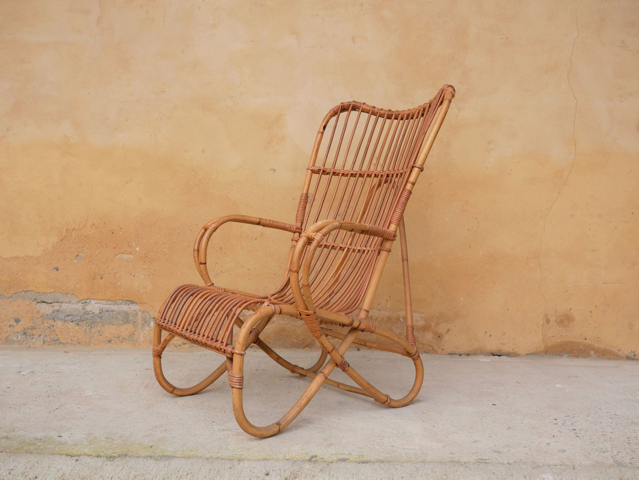 Vintage rattan chair by Louis Sognot