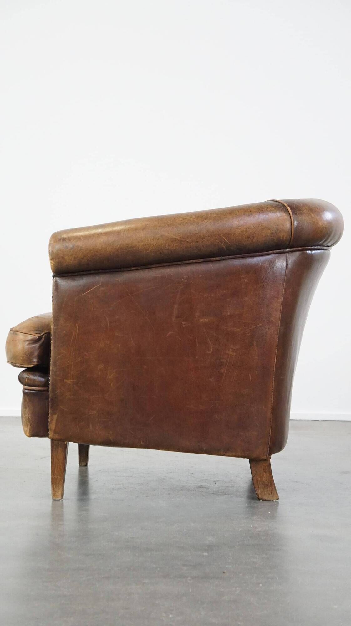 Characterful sheepskin leather club armchair with a luxurious, rustic appearance