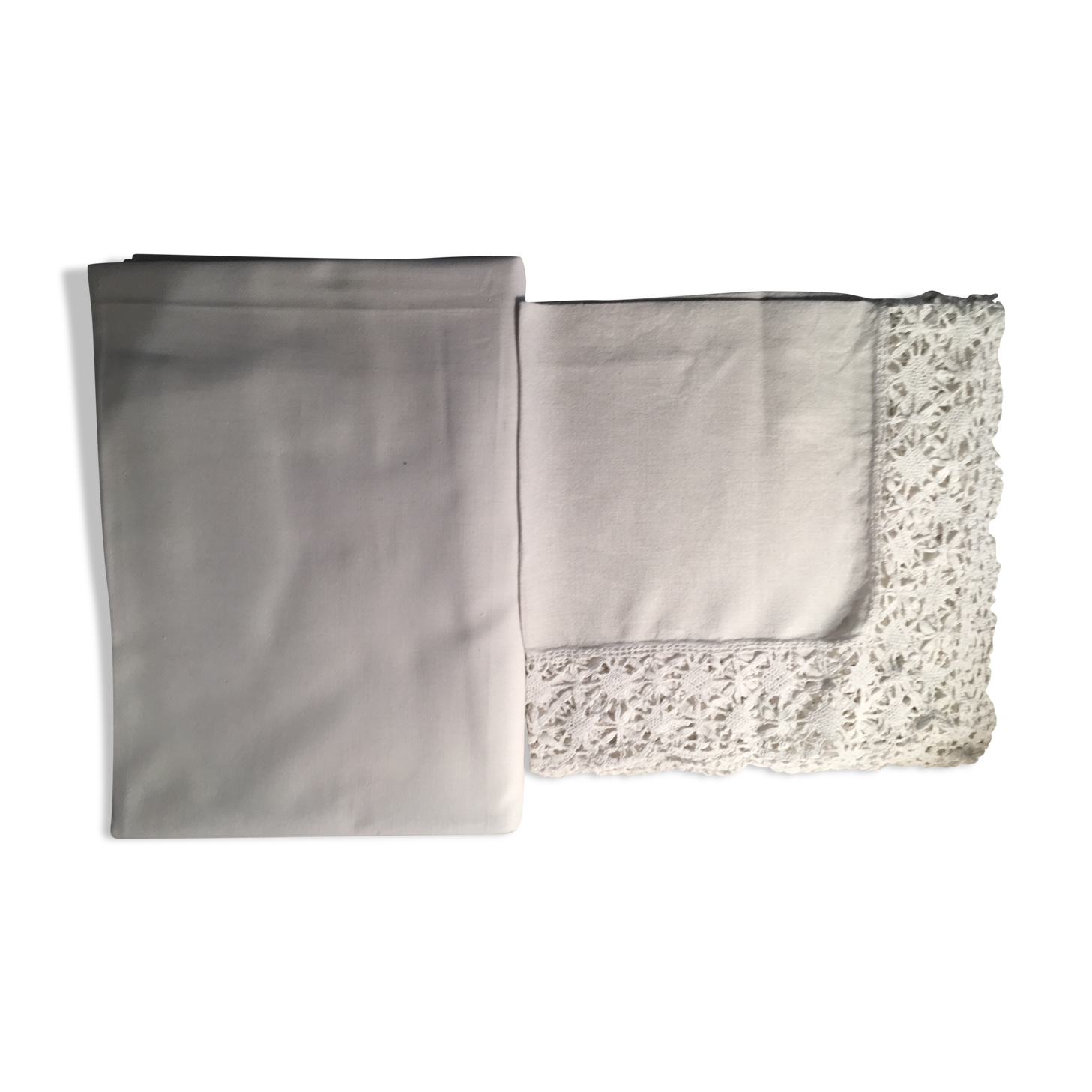 Old embroidered white linen and surnappe tablecloth